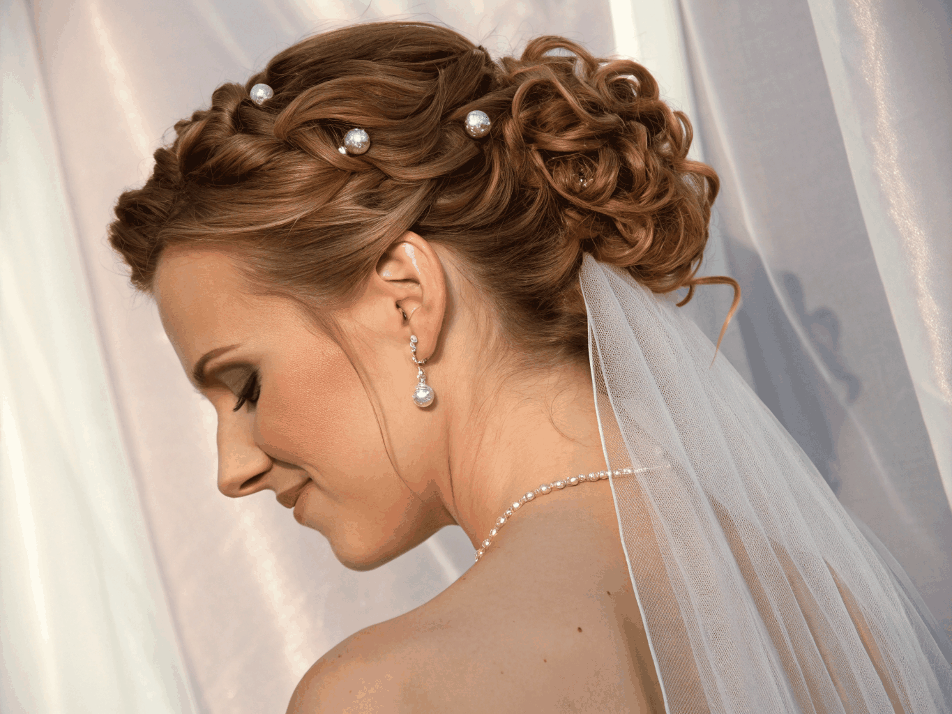 Intricate bridal updo with soft texture