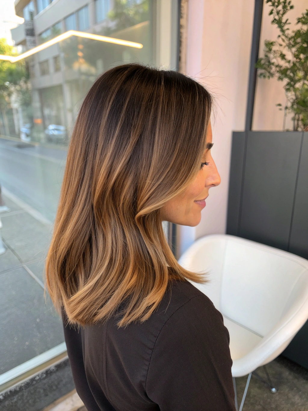 Colorist applying custom balayage highlights